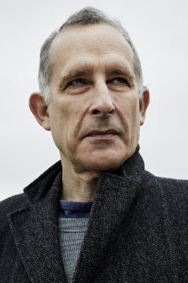 Publicity shot of Nick Revell staring into the distance